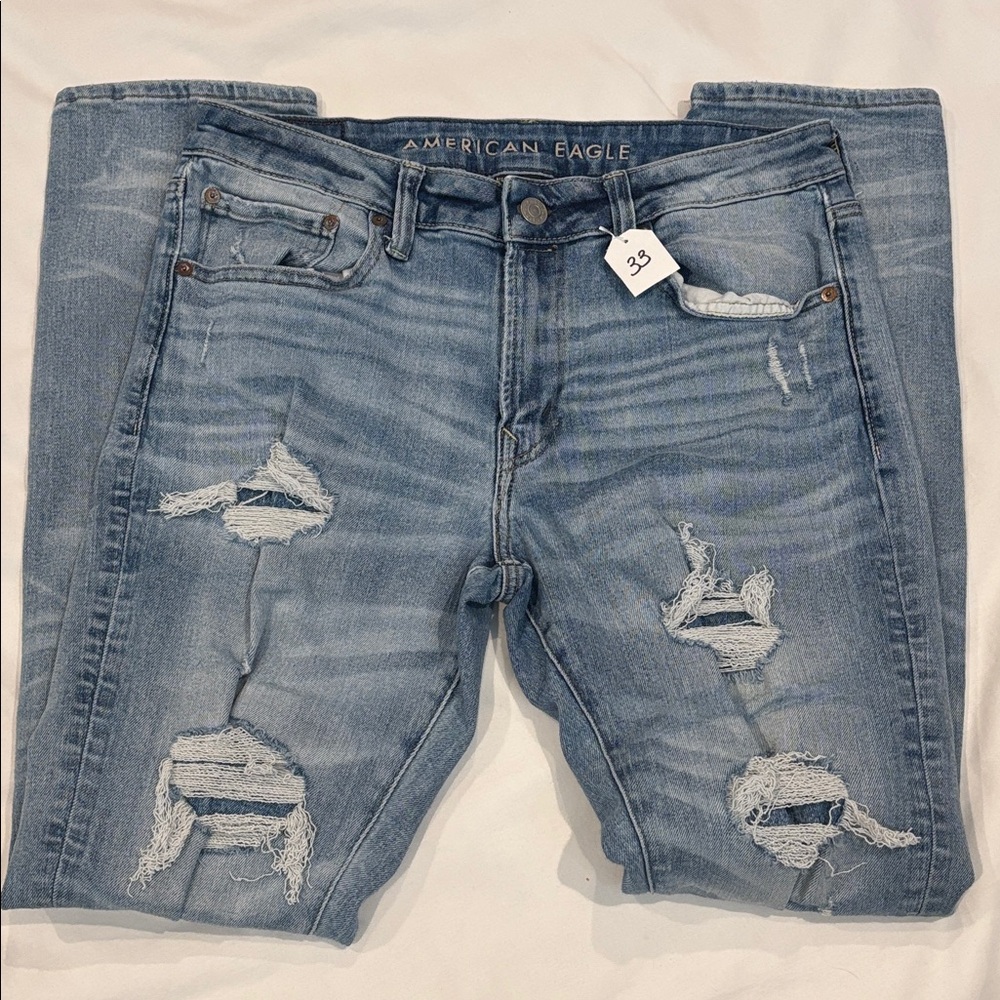 American Eagle Outfitters Next Level Airflex Light Blue Distressed Slim Jeans